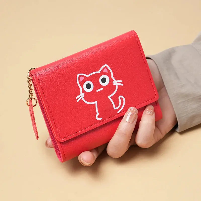 Red short-style purse for women with white cat graphic; compact wallet with card slots