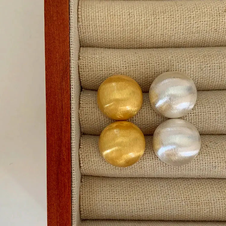 Simples Market brushed frosted metal semicircle earrings in gold and silver tones, set of four in a jewelry box.