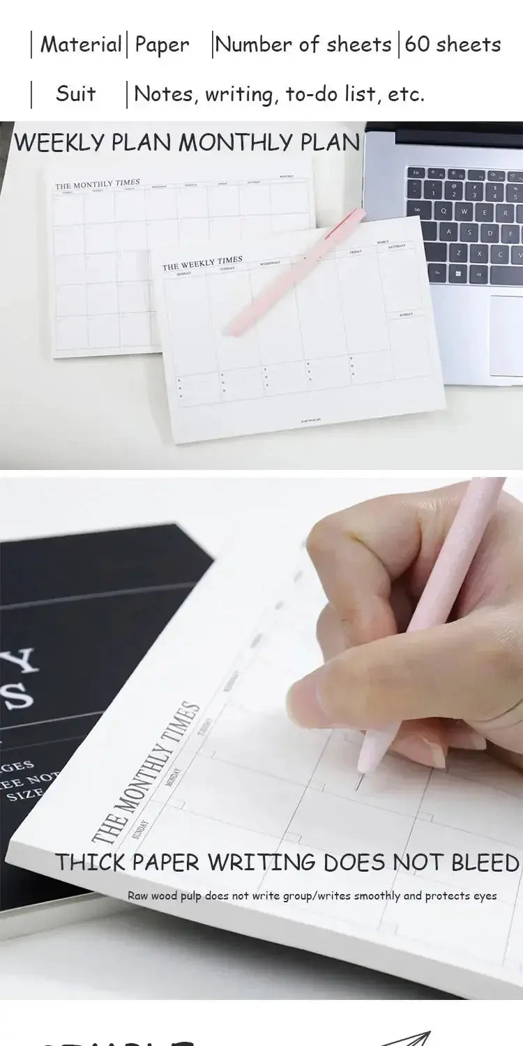 Weekly planner notebook with undated monthly calendar, pink pencil, and laptop on white desk