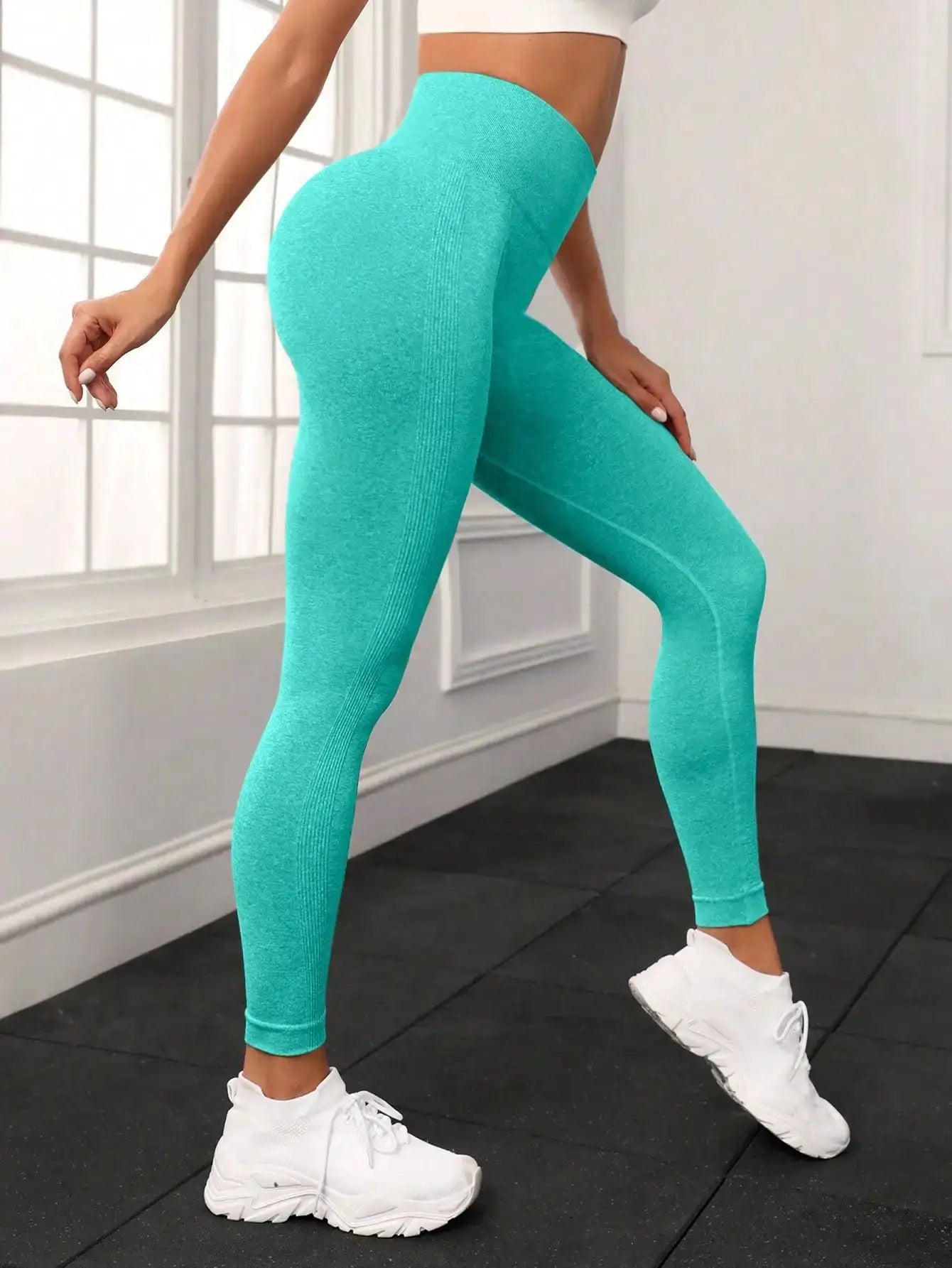 Seamless turquoise high-waisted yoga pants with hip-lift fit for women
