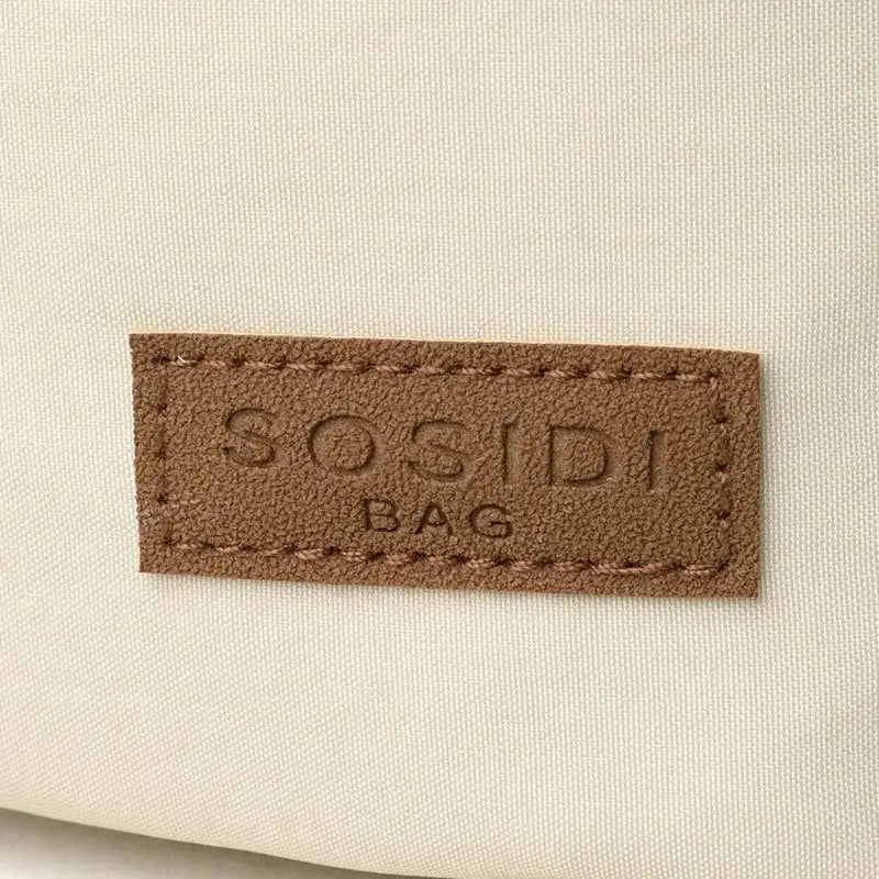 Crossbody bag SOSIDI, beige canvas with brown leather patch.
