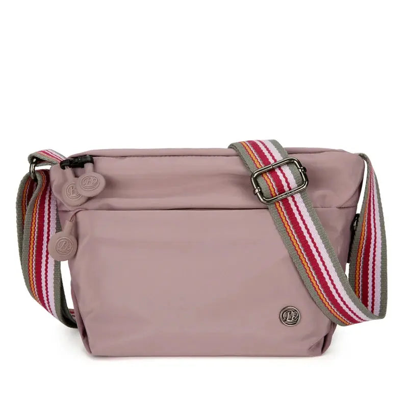 Simples Market pink nylon crossbody bag with a wide striped adjustable strap and zipper closure