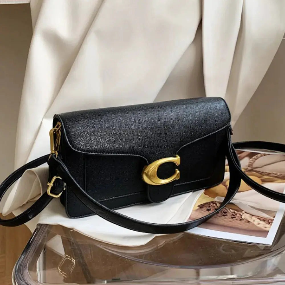 Double-Strap Small Square Crossbody Bag by Simples Market in black faux leather with gold-tone hardware.