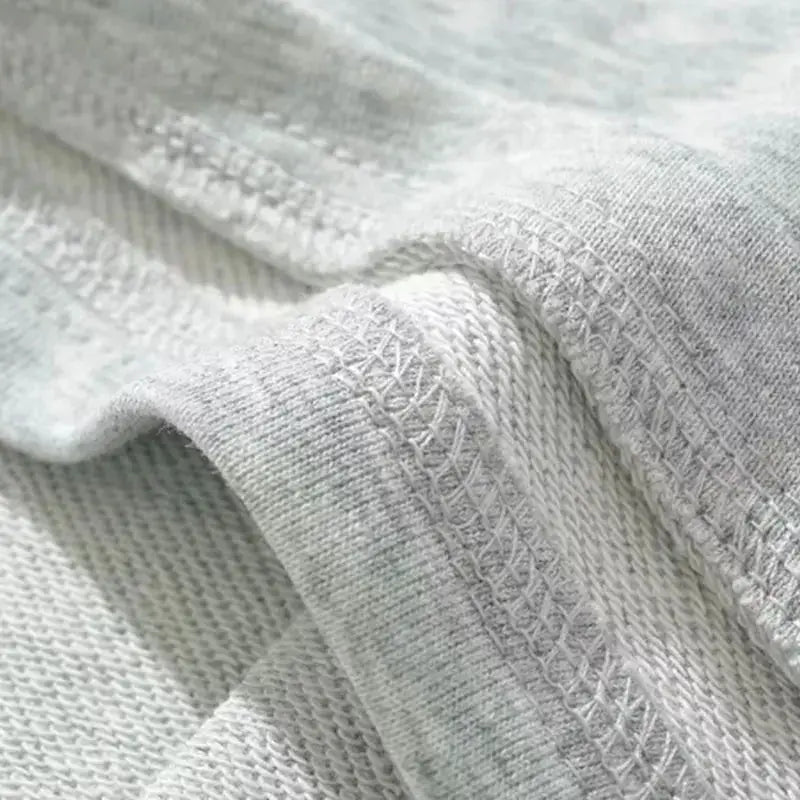 Mooyufon fabric in light grey, close-up of soft knit textile texture