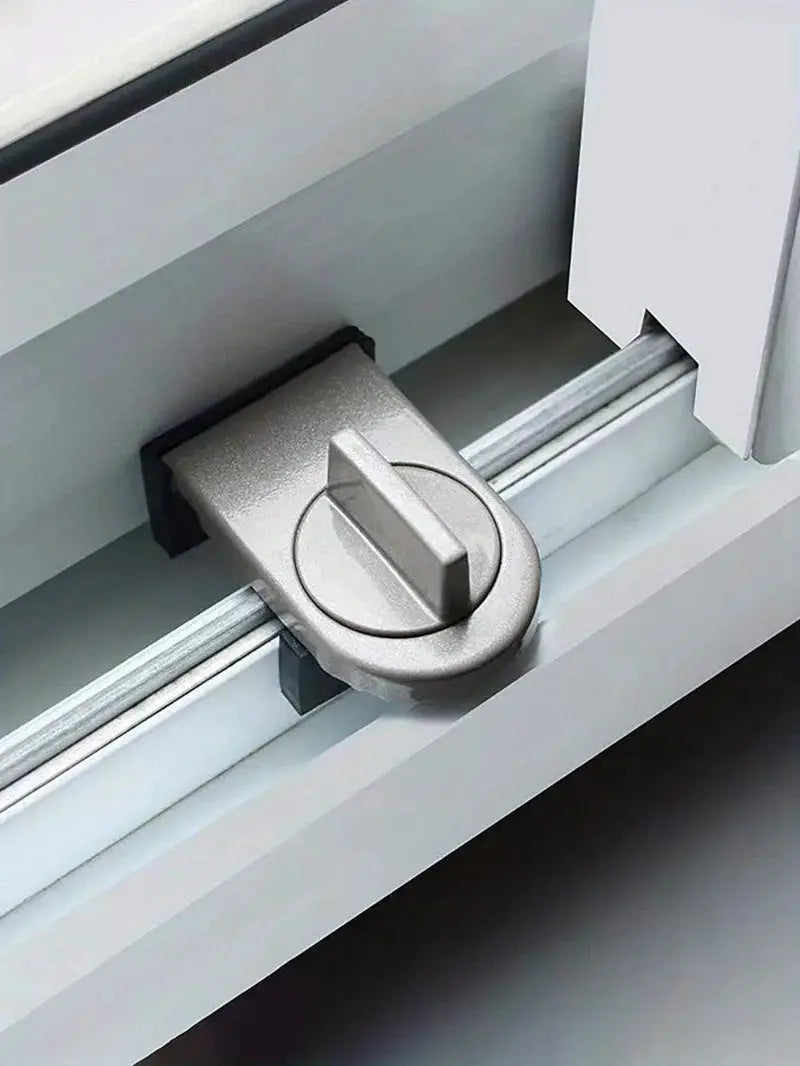 Sliding sash stopper lock, silver metal door/window security latch for child safety.