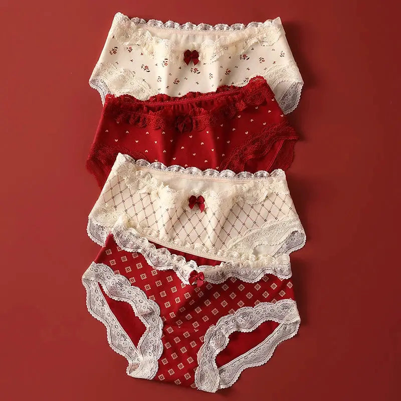 Lace panties set, five-pack, ivory and red with bows and scalloped trim.