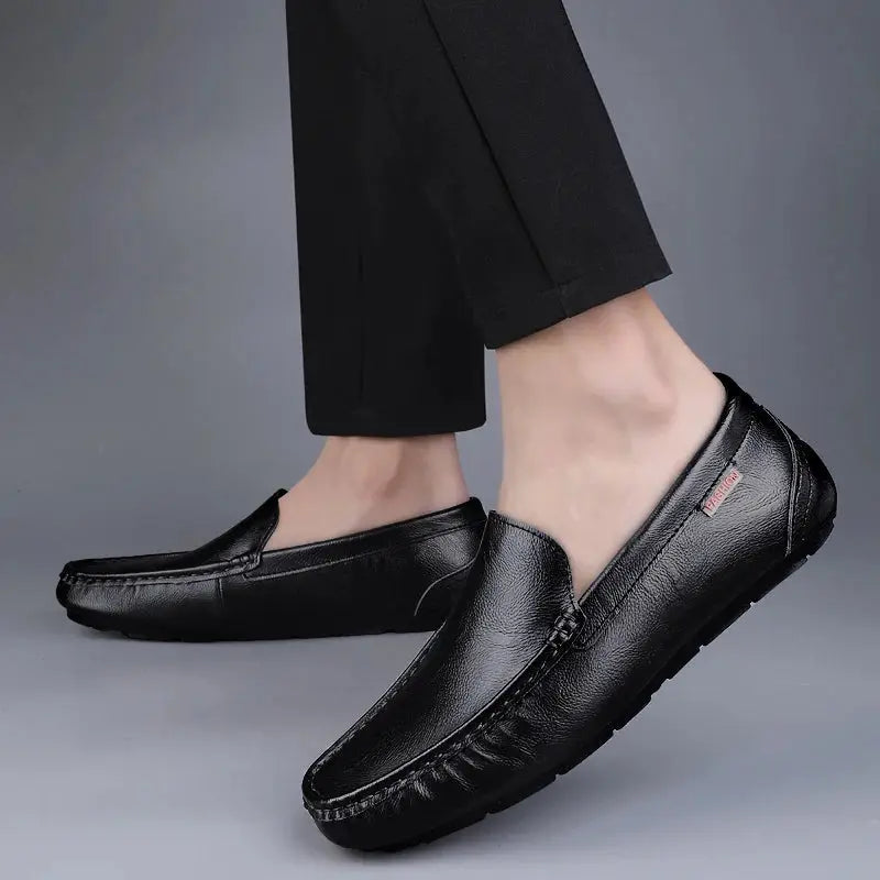 Pair of black genuine leather men's loafers slip-on driving moccasins