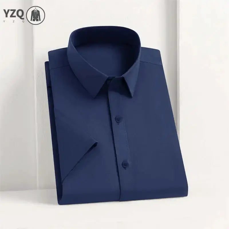 Men's solid navy blue dress shirt with YZQ logo for versatile business wear