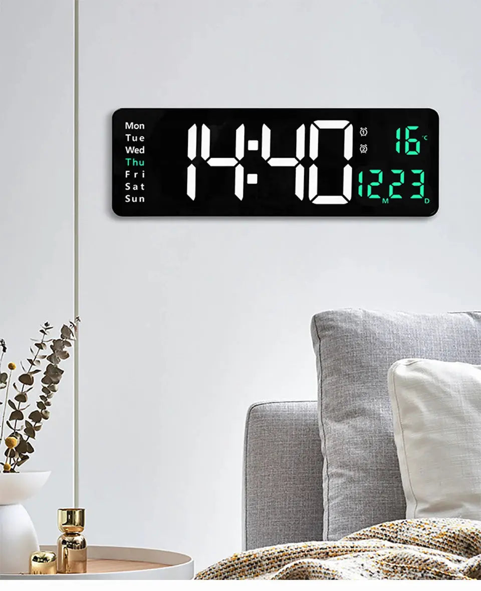 Large black digital wall clock with green LED display, weekday column on left and temperature readout on right