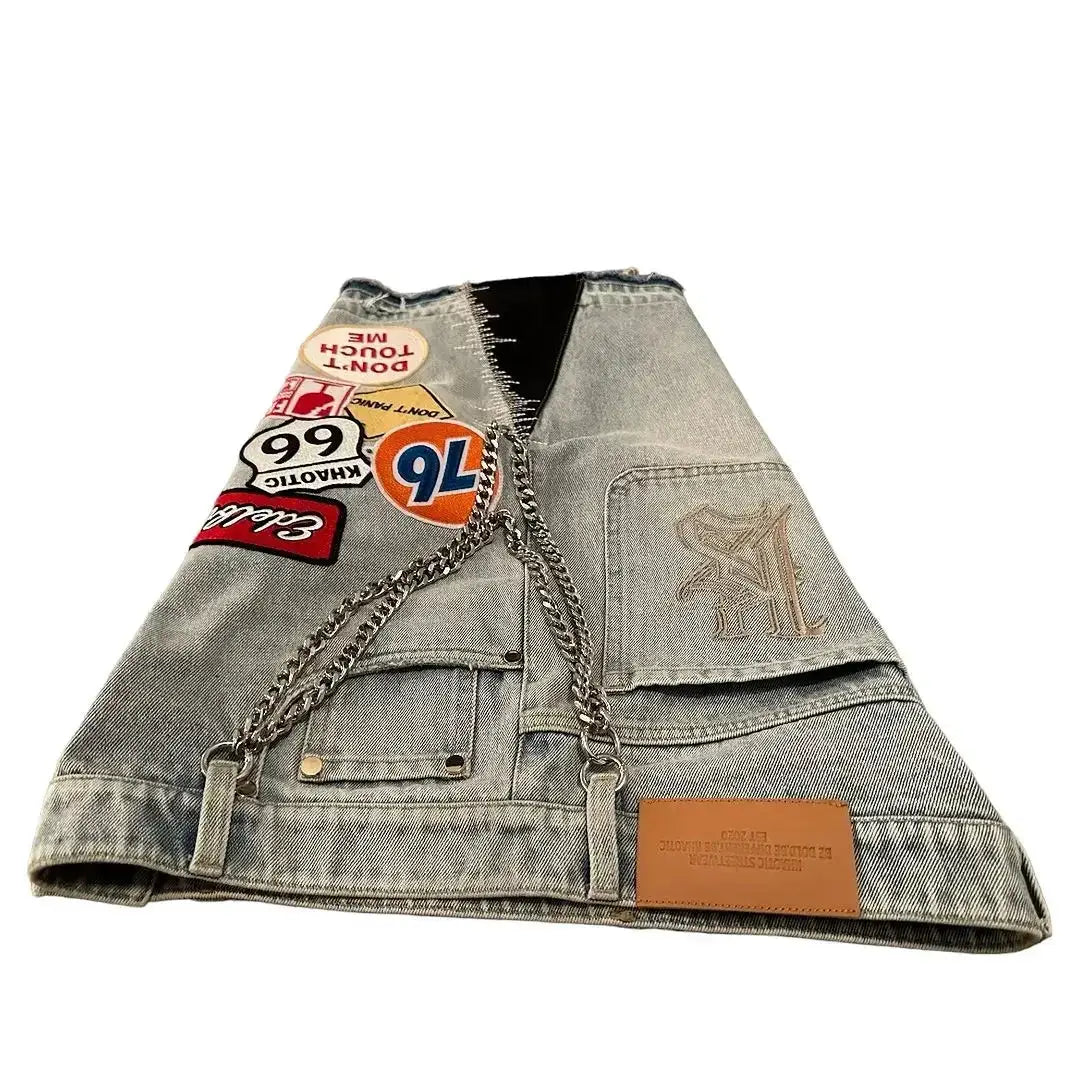 Denim patchwork bag with metal chain strap, stone-blue wash, and a leather brand patch from Simples Market
