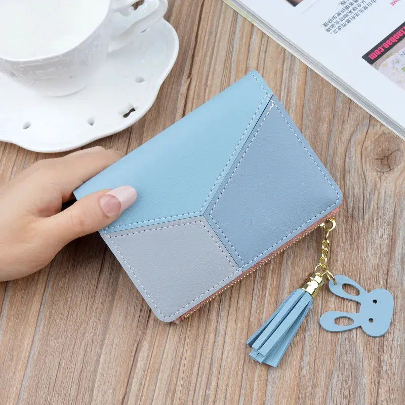 Fashion wallet PU leather in pastel blue geometric panels with tassel charm, clutch-style