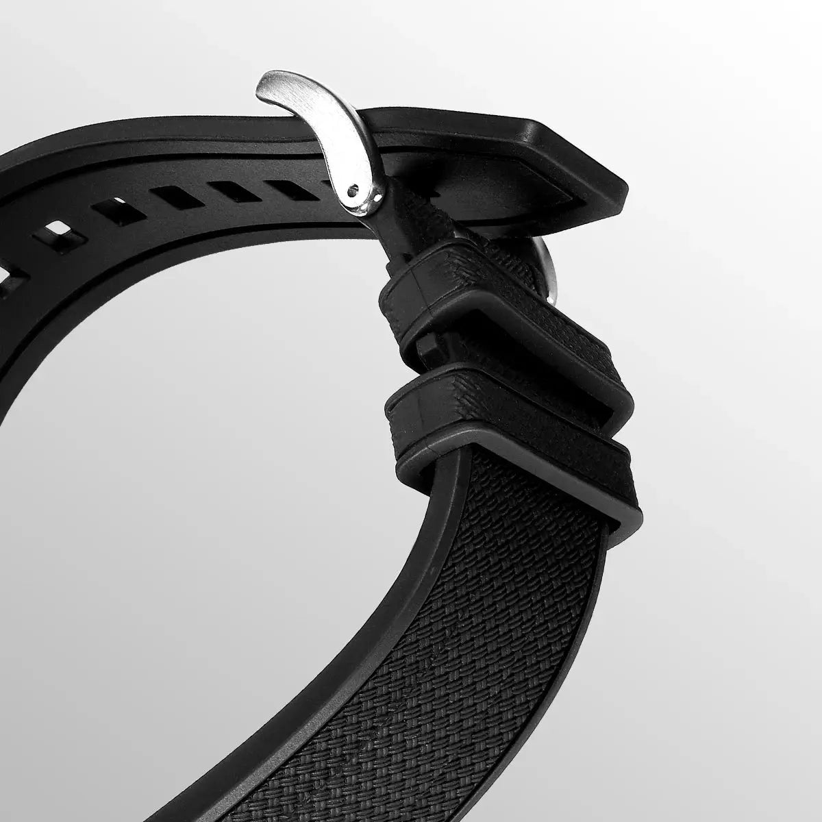 Black textured watch strap with a silver buckle for a 40mm automatic diver watch