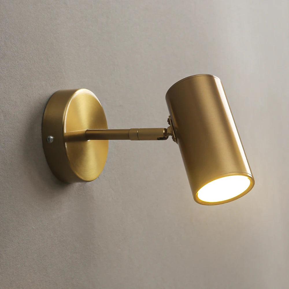 Nordic modern brass wall lamp by Simples Market with adjustable cylindrical LED light