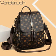 Ladies backpack by Vanderwah in brown faux leather with gold tassel accents, floral print, large capacity