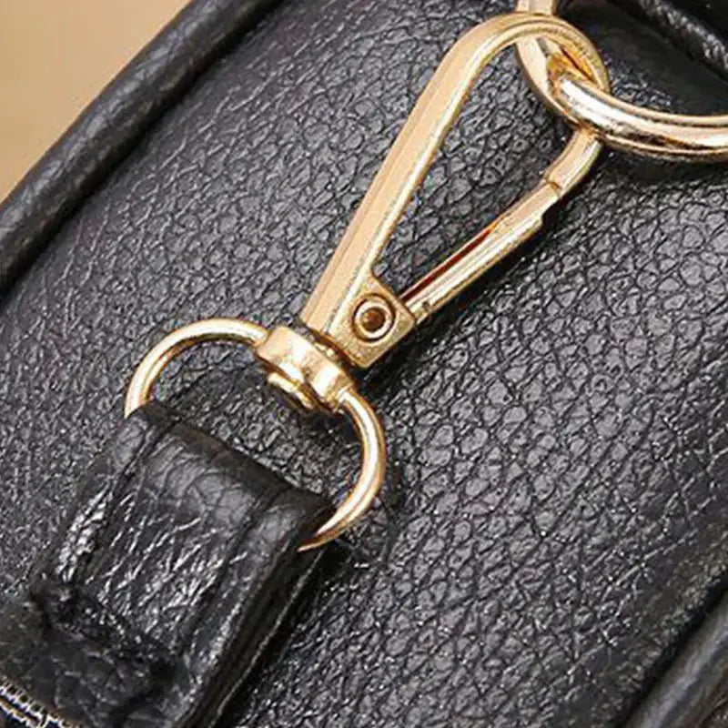 Gentle Compact Quilted Oval Crossbody Bag by Simples Market, black PU leather, gold-tone hardware