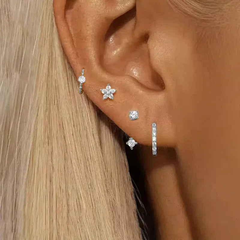 Simples Market 4-piece zircon earring set in silver with flower/star-shaped studs and huggie hoops