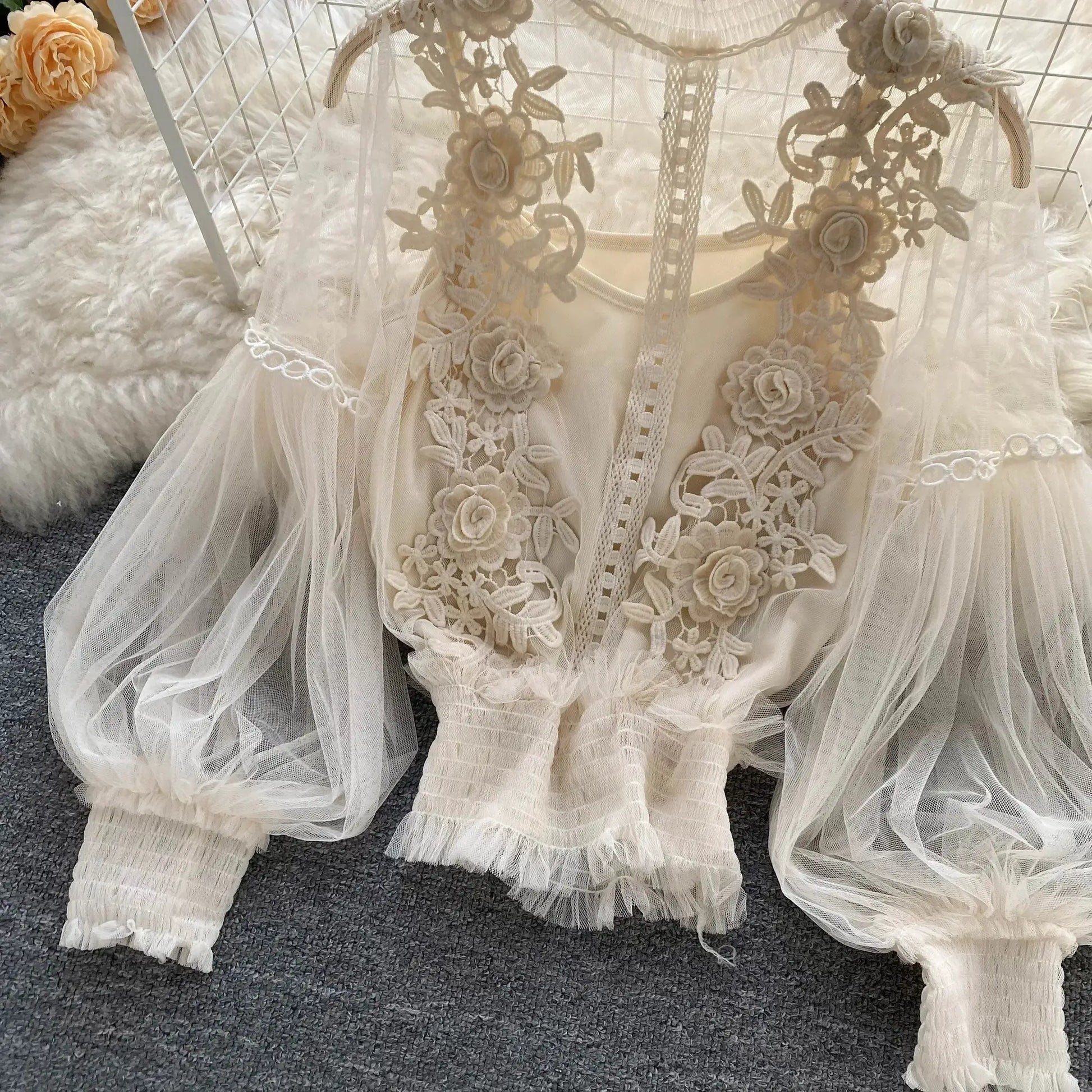 Ivory lace puff-sleeve blouse with floral appliqué and sheer tulle panels