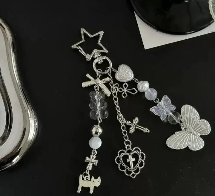 Y2k Harajuku ita bag with silver-tone charm keychain featuring star, butterfly, and cross charms