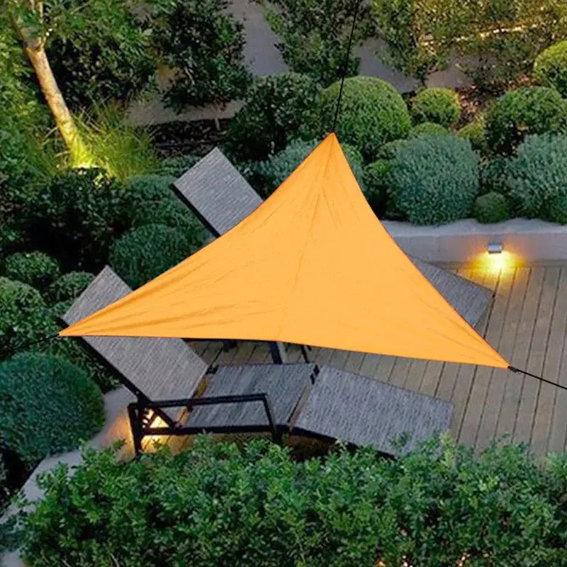 Simples Market 3x3m triangle sun shade canopy, orange waterproof fabric over two lounge chairs on a wooden deck