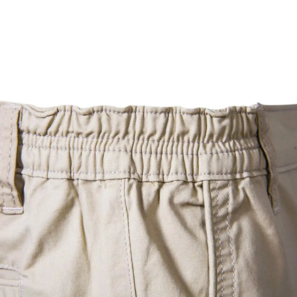 Men's solid beige cotton shorts with elastic waistband for casual beachwear