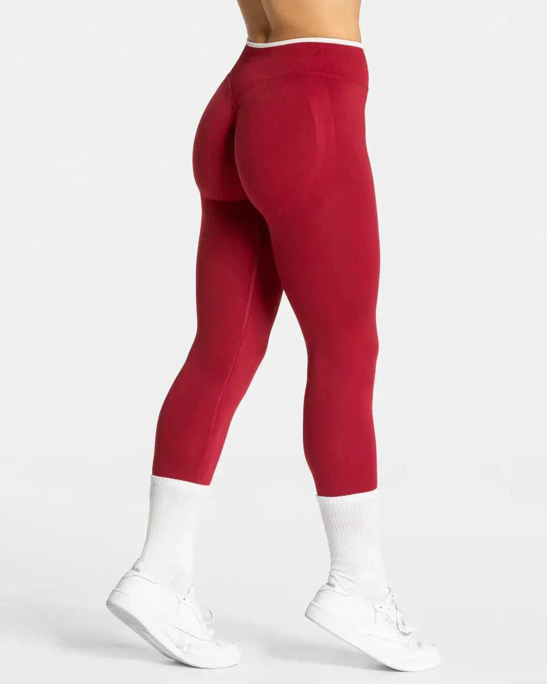 Women's red seamless high-waist yoga leggings with white-edged waistband