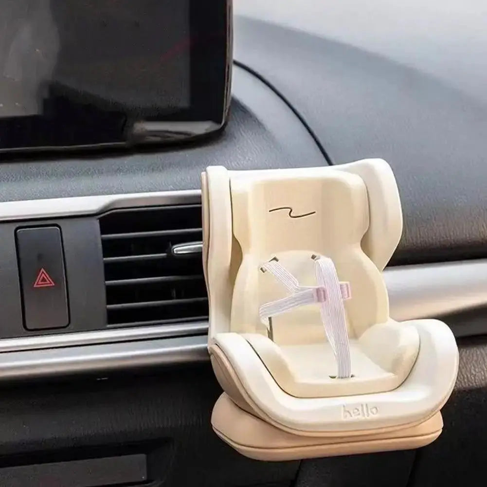 Beige plastic car doll safety seat with white harness for 17cm dolls, mounted on car dashboard by Simples Market