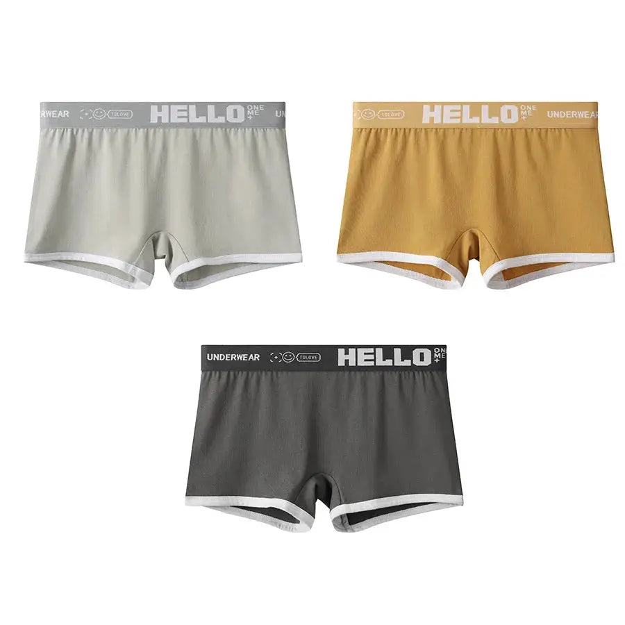 3-pack women's cotton boyshorts set in grey, mustard, and charcoal with white trim and HELLO waistband.