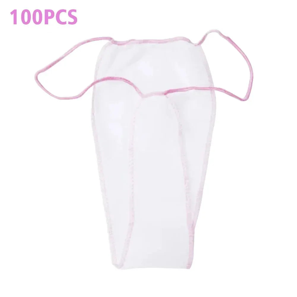 Disposable women's thong tanning wrap, white nonwoven fabric with pink trim and side ties