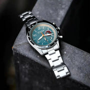 CILOA men's stainless steel waterproof quartz watch with teal dial, black bezel, and silver bracelet