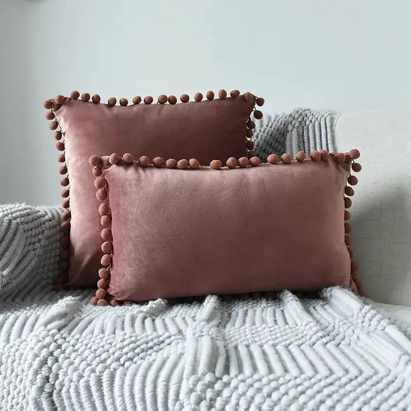 Two mauve velvet cushion covers with tassel fringe for sofa