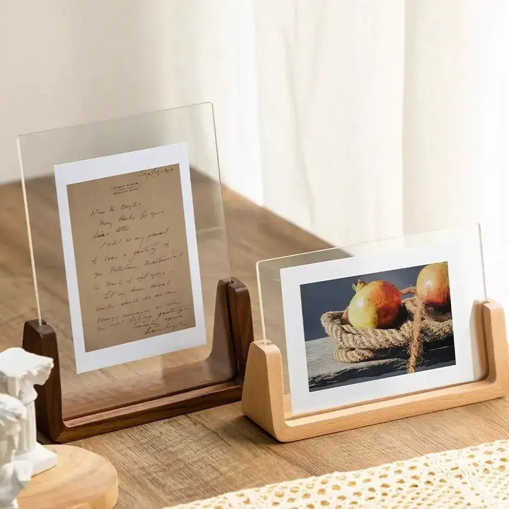 Two walnut and beech acrylic U-frame photo display frames by Simples Market