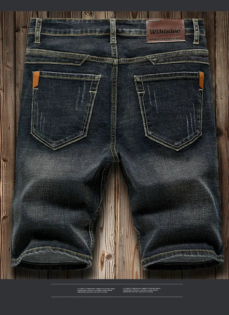 Simples Market men's slim-fit dark denim shorts with back pockets and brown leather patch