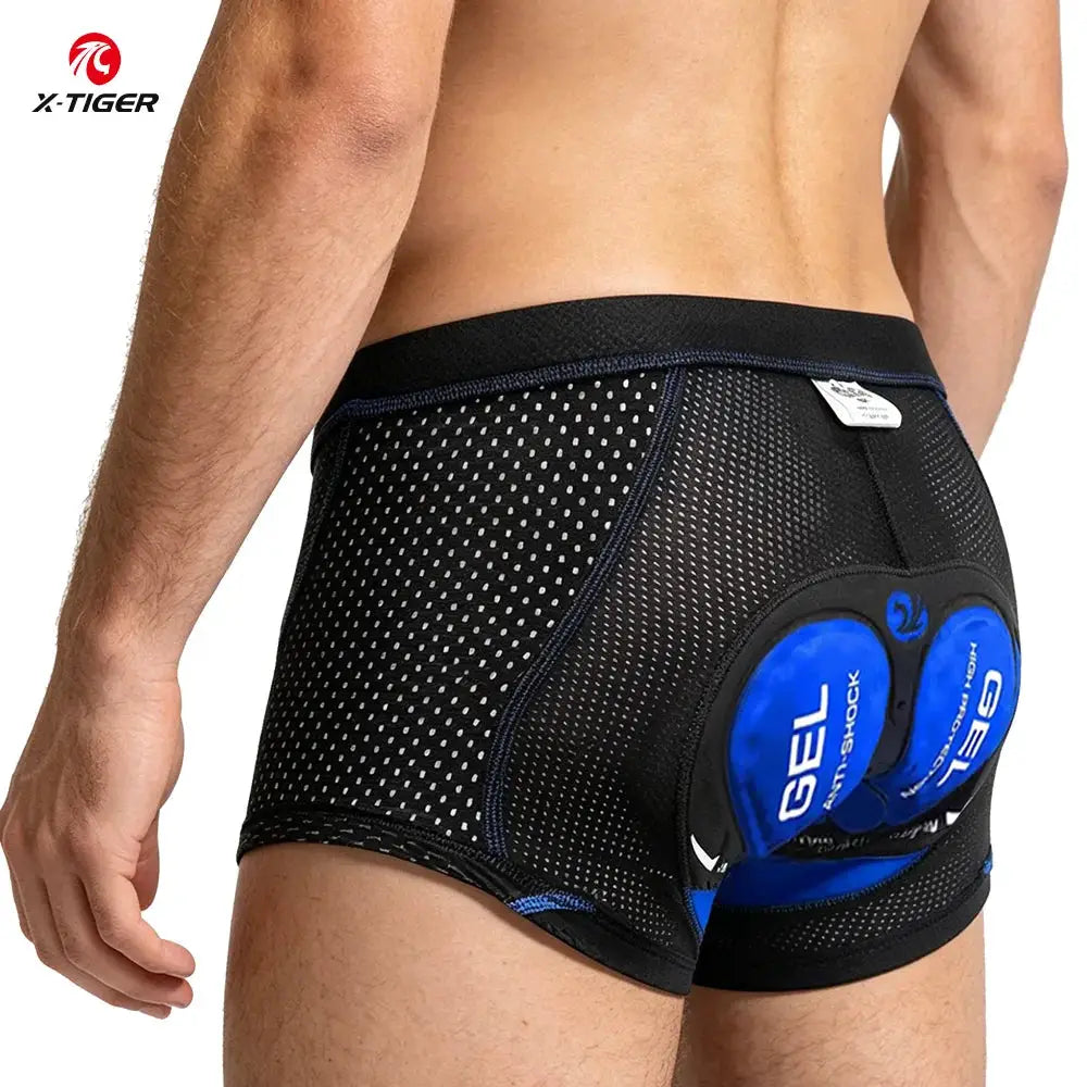 X-TIGER men's cycling shorts with 5D gel cushions, black mesh fabric and blue pads.