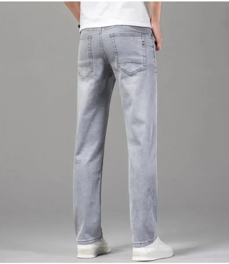 Men's gray cotton jeans with back pockets and straight leg.
