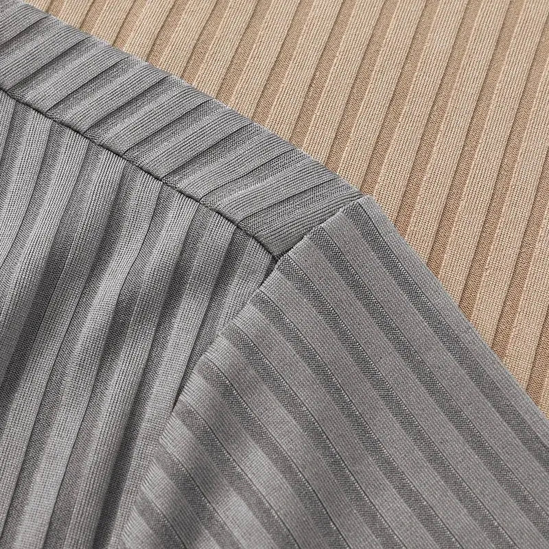 Men's striped gray polo shirt; breathable textured fabric close-up, Simples Market.