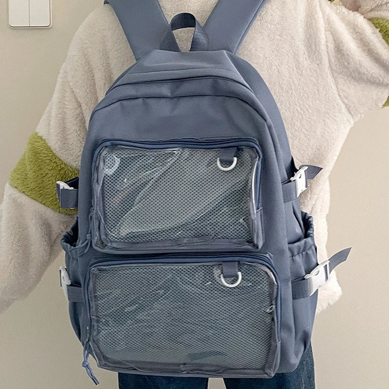 Blue Japanese-style transparent ita bag backpack with two mesh front pockets, side straps, and large capacity