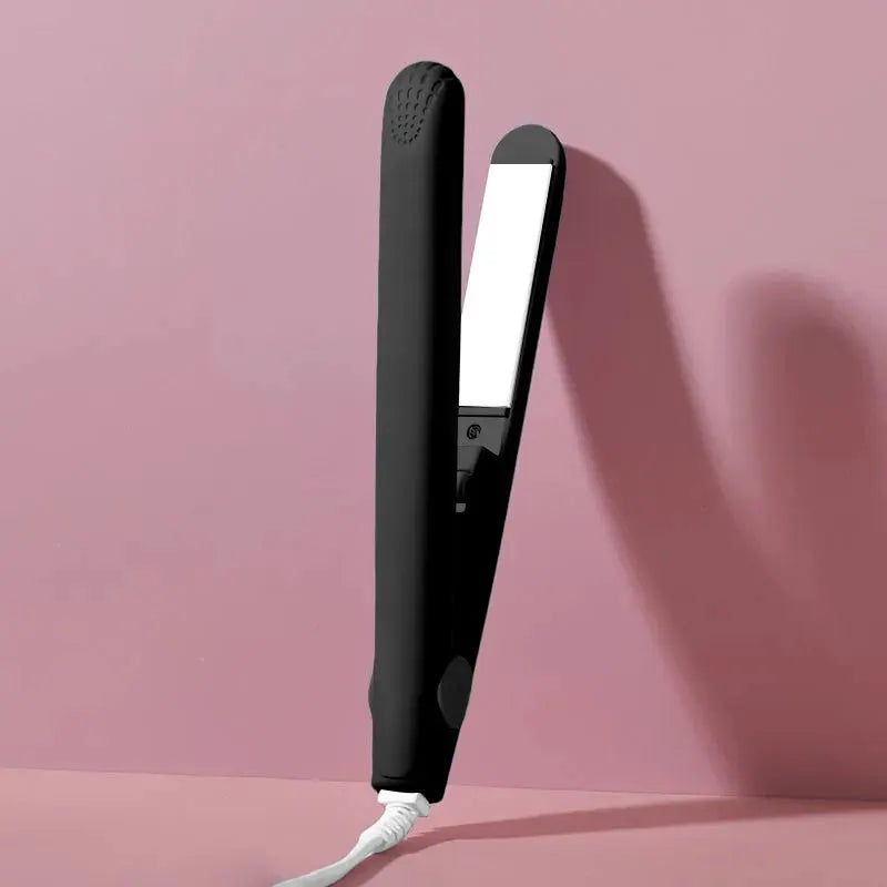 Flat iron hair straightener with black body and white ceramic plates, power cord visible
