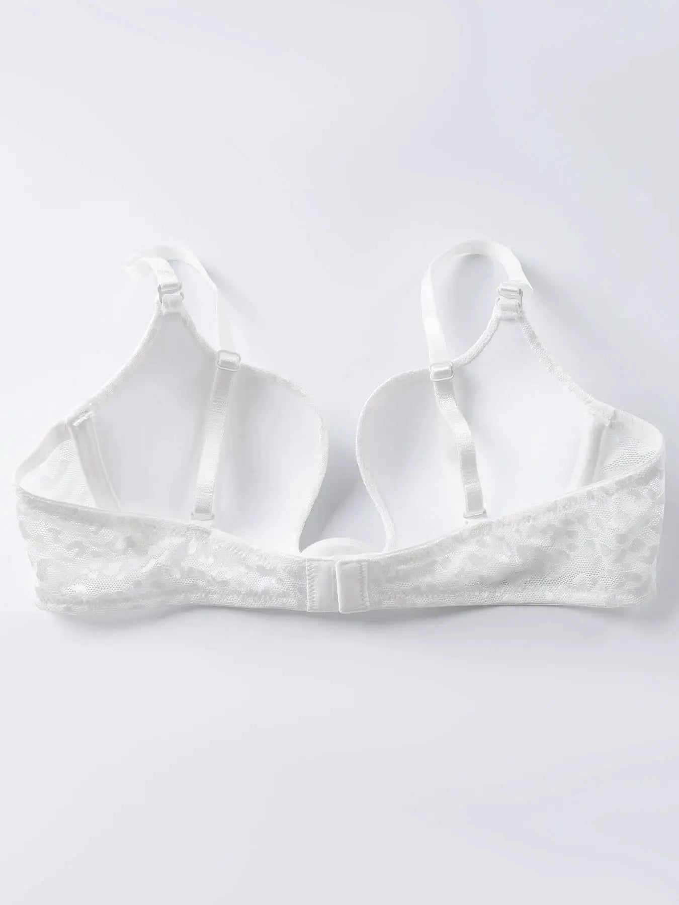 Two white lace underwire padded bras with adjustable straps