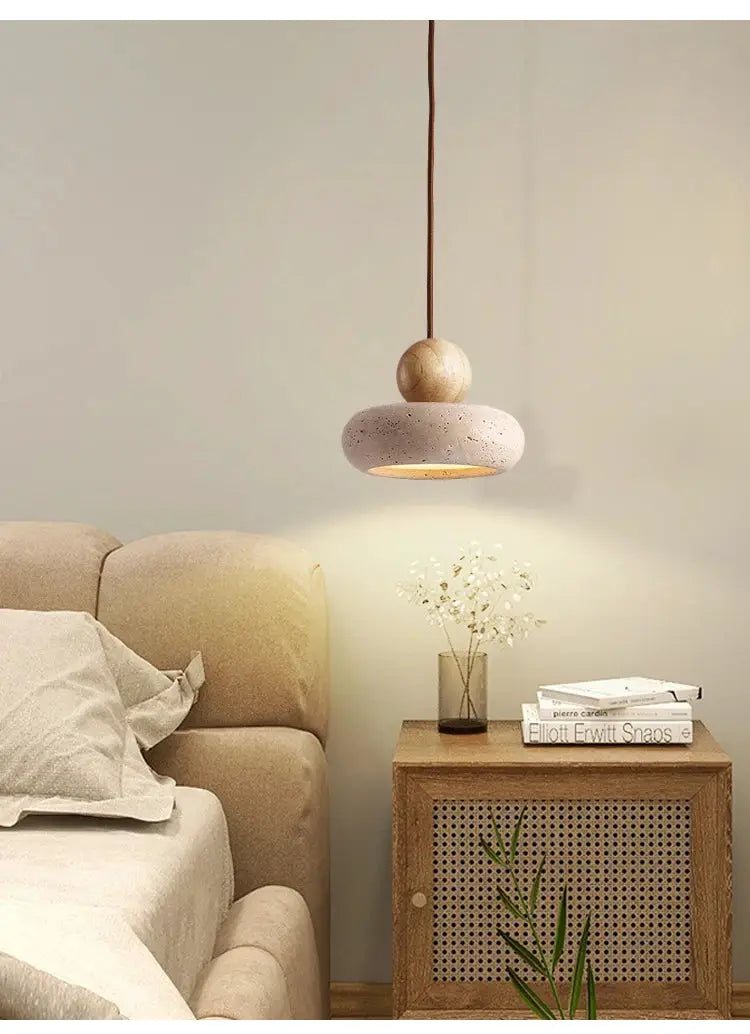 Vintage pendant light with natural yellow agate stone, donut-shaped shade and warm downward glow