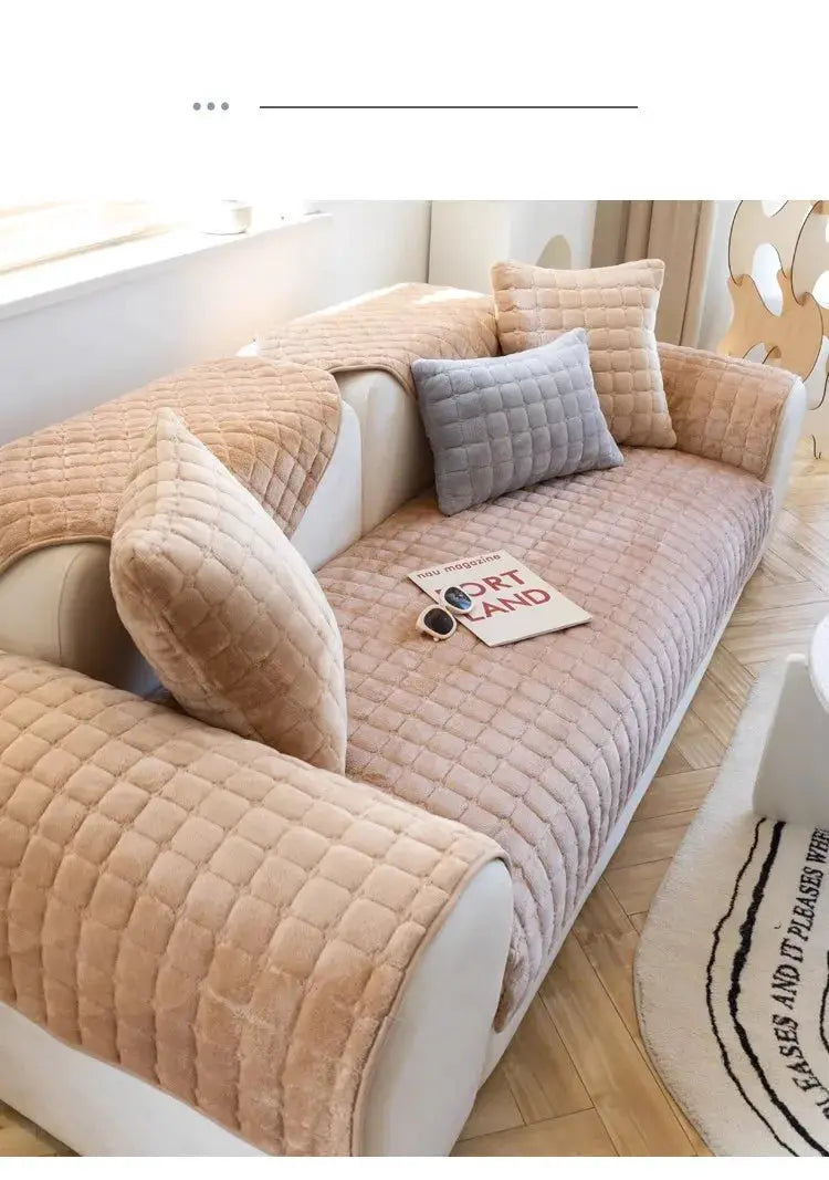 Sofa cover set in beige plush plaid velvet with non-slip backing and matching cushions on a white sofa