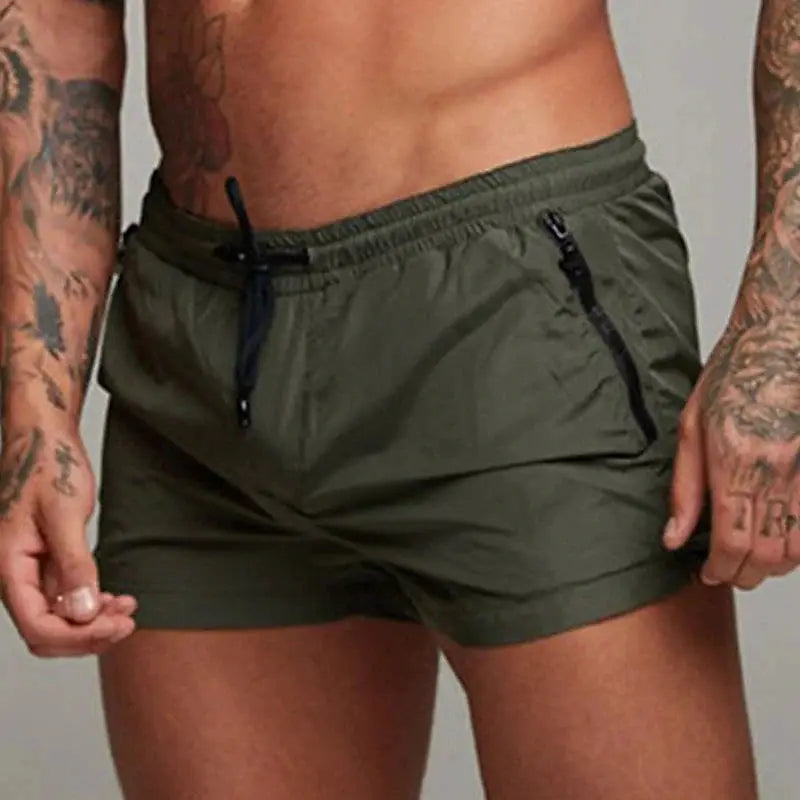 Men's olive green swim trunks with black drawstring and zip pockets