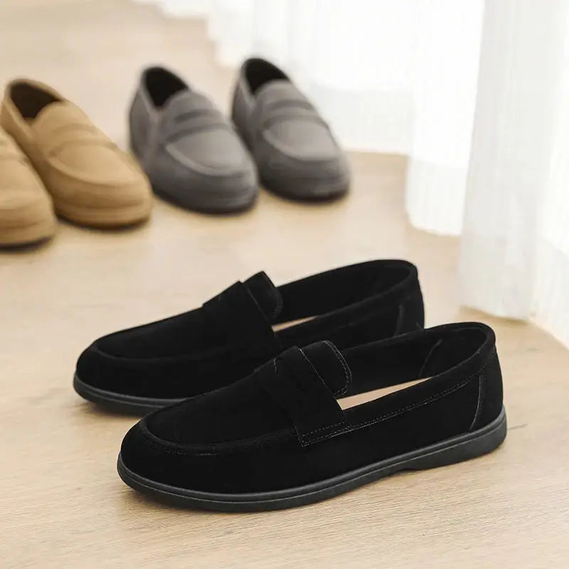 Men's black slip-on loafers with suede-like uppers; lightweight, comfy, soft sole; four pairs shown