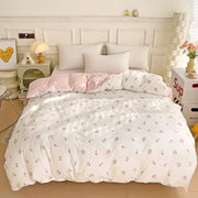 3-piece knitted and washed double-layer yarn bed set with quilt cover and two pillowcases, white with floral print.