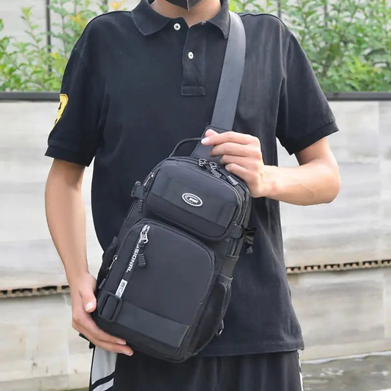 Lightweight men's crossbody bag being carried by a man in a black shirt, showcasing its versatile design.