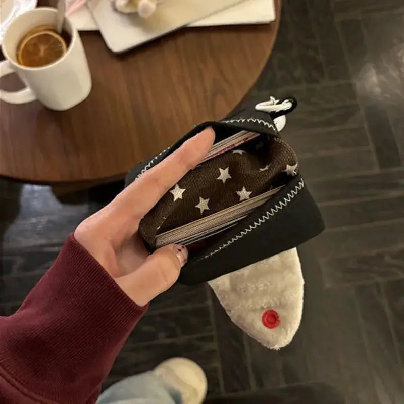 Rice Ball Card Holder Coin Purse by Simples Market, black canvas exterior with star-pattern lining, compact wallet
