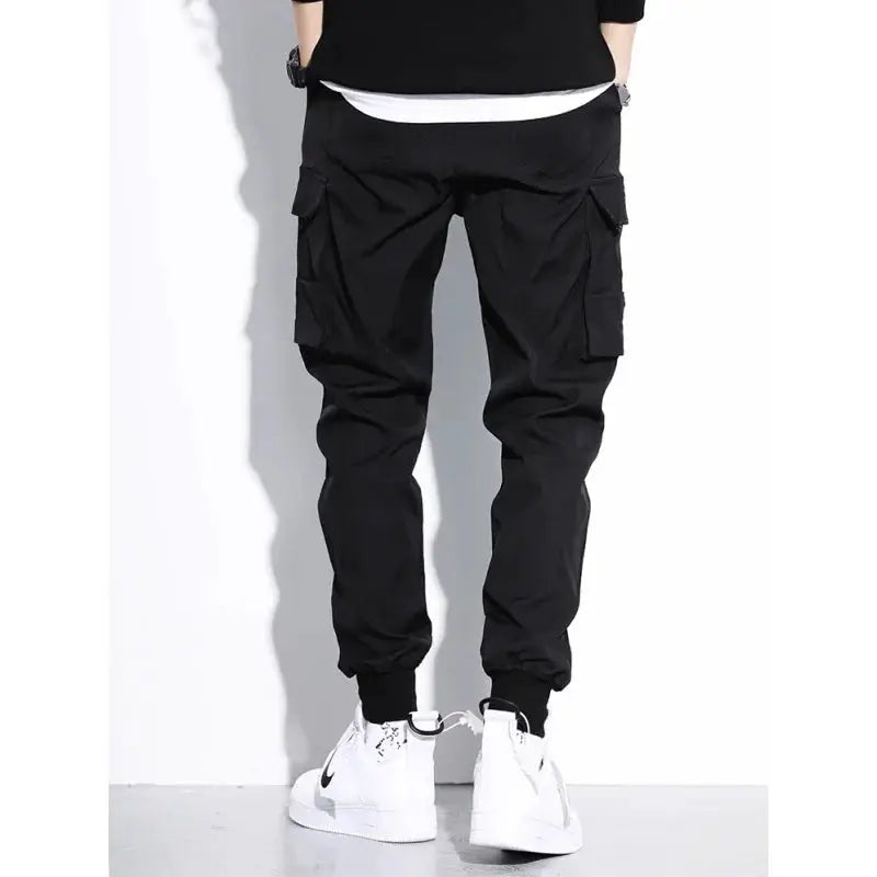 Simples Market men's tactical work pants with multiple cargo pockets, black jogger-style.