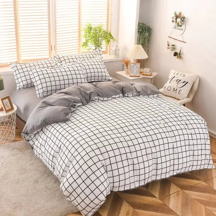 Simples Market four-piece cotton bedding set with white grid-pattern duvet cover and pillowcases, gray reverse.