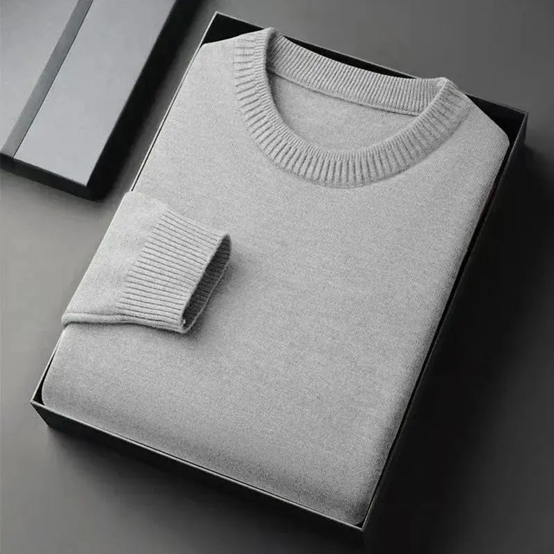 Men's crewneck knit pullover sweater in light gray, soft lightweight fabric, folded in a box