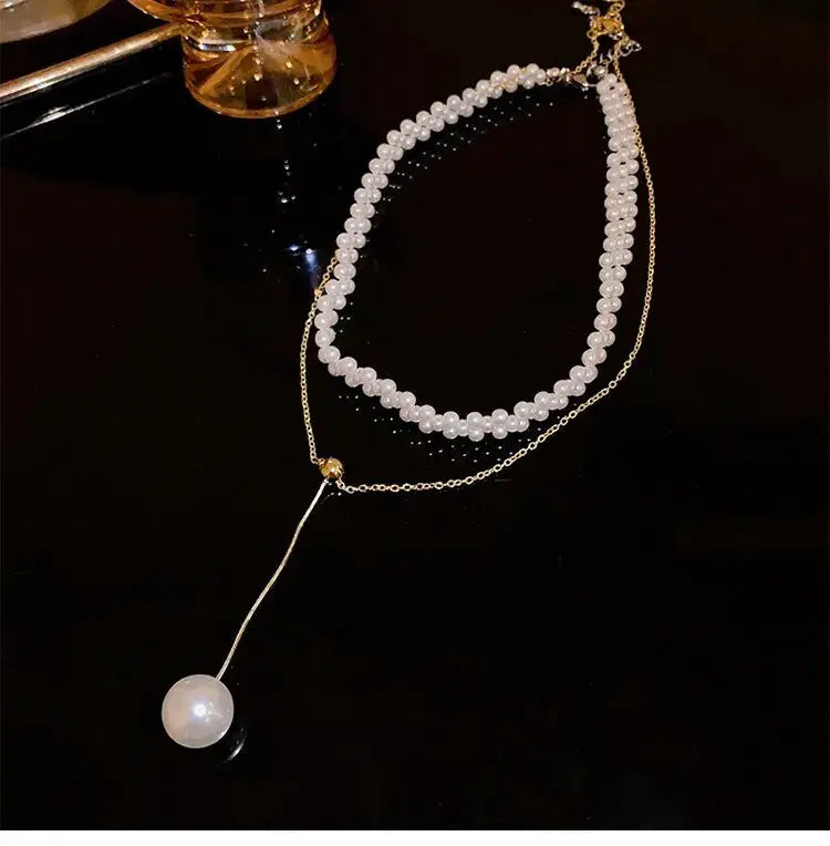Imitation pearl necklace for women with double white pearl strands and gold-tone lariat pendant drop