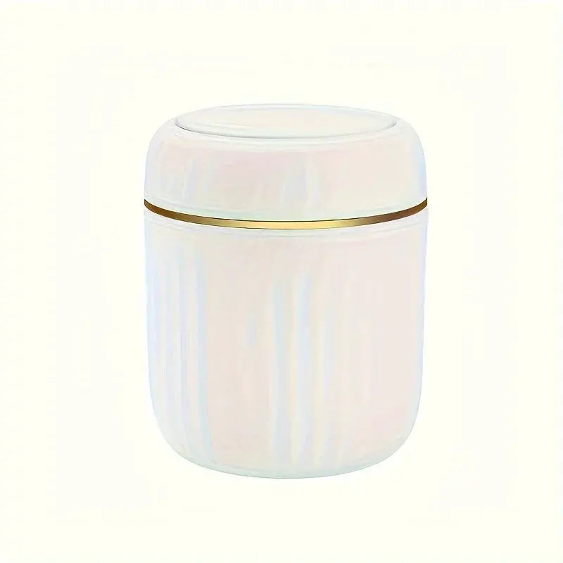 Mini desktop trash can with lid, white translucent plastic with a slim gold band.